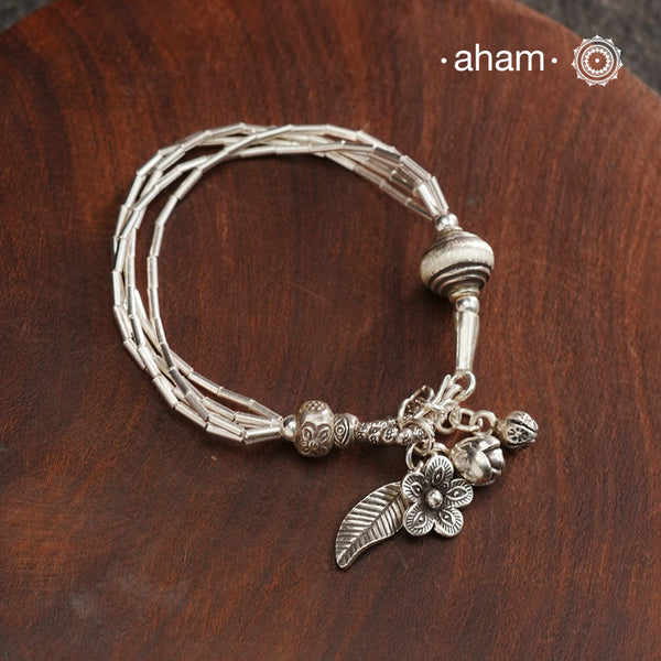 Up your wrist game with the A.M P.M Silver bracelet! Beautiful distinct charms all crafted in 92.5 silver come together to make this piece. Whether worn at day or night, this bracelet is perfect for adding a playful touch to any outfit.The price is for one piece only.
