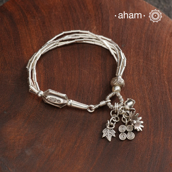 Up your wrist game with the A.M P.M Silver bracelet! Beautiful distinct charms all crafted in 92.5 silver come together to make this piece. Whether worn at day or night, this bracelet is perfect for adding a playful touch to any outfit.The price is for one piece only.