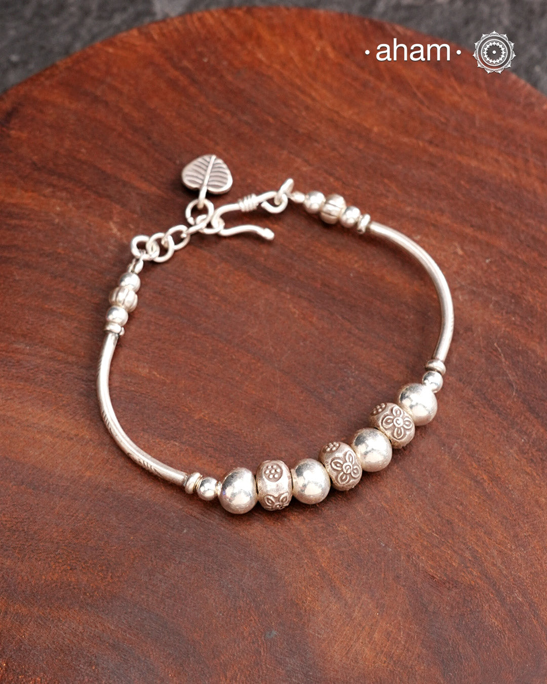Up your wrist game with the A.M P.M Silver bracelet!
beautiful distinct charms all crafted in 92.5 silver come together to make this piece .
Whether worn at day or night, this bracelet is Perfect for adding a playful touch to any outfit.
The price is for one piece only.