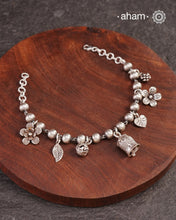 Up your wrist game with the A.M P.M Silver bracelet!
7 beautiful distinct charms all crafted in 92.5 silver come together to make this piece . Whether worn at day or night, this bracelet is Perfect for adding a playful touch to any outfit.&nbsp;