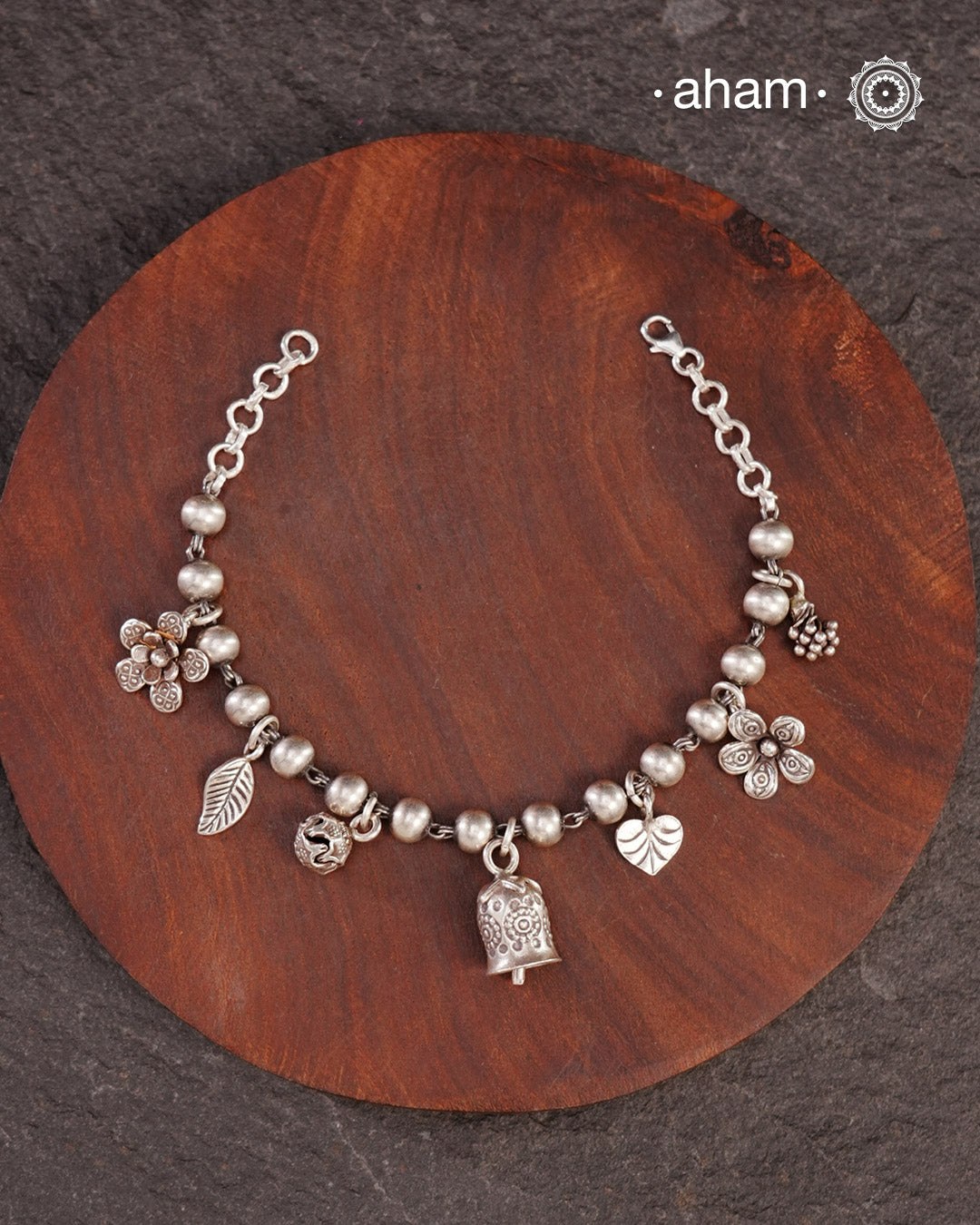 Up your wrist game with the A.M P.M Silver bracelet!
7 beautiful distinct charms all crafted in 92.5 silver come together to make this piece . Whether worn at day or night, this bracelet is Perfect for adding a playful touch to any outfit. 