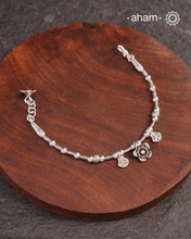 Up your wrist game with the A.M P.M Silver bracelet!
beautiful distinct charms all crafted in 92.5 silver come together to make this piece .

Whether worn at day or night, this bracelet is Perfect for adding a playful touch to any outfit.

The price is for one piece only.
