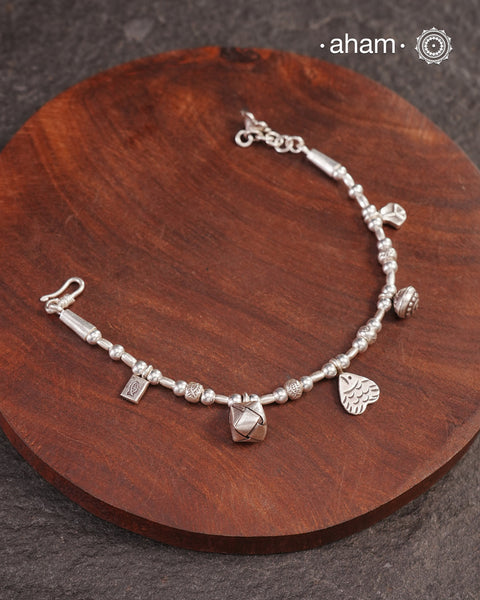 Up your wrist game with the A.M P.M Silver bracelet!
beautiful distinct charms all crafted in 92.5 silver come together to make this piece .

Whether worn at day or night, this bracelet is Perfect for adding a playful touch to any outfit.

The price is for one piece only.