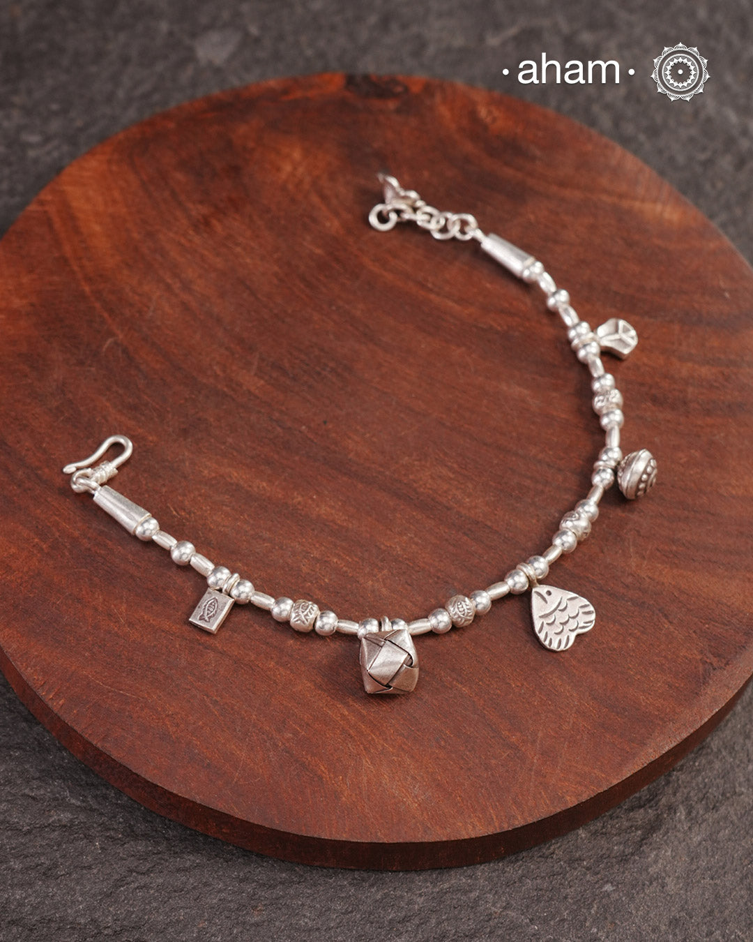 Up your wrist game with the A.M P.M Silver bracelet!
beautiful distinct charms all crafted in 92.5 silver come together to make this piece .

Whether worn at day or night, this bracelet is Perfect for adding a playful touch to any outfit.

The price is for one piece only.