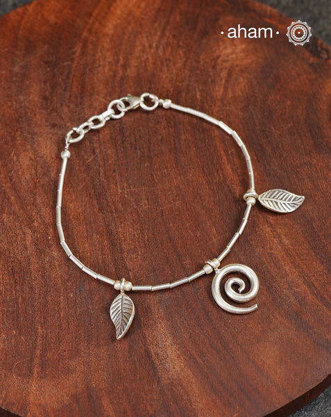 Up your wrist game with the A.M P.M Silver bracelet! Beautiful distinct charms all crafted in 92.5 silver come together to make this piece. Whether worn at day or night, this bracelet is Perfect for adding a playful touch to any outfit.