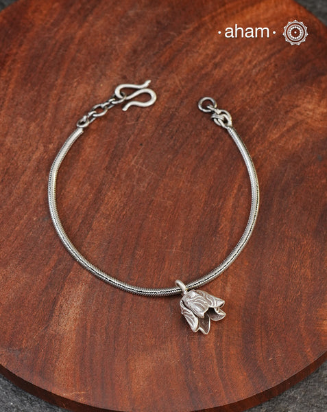 Add a playful touch to your look with this beautiful Flower Bud cham bracelet crafted in 92.5 silver. Even Looks great when stacked with other bracelets or worn with a watch.
