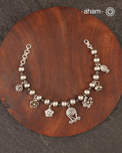 Up your wrist game with the A.M P.M Silver bracelet!
7 beautiful distinct charms all crafted in 92.5 silver come together to make this piece . Whether worn at day or night, this bracelet is Perfect for adding a playful touch to any outfit.

The price is for one piece only.