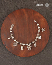 Up your wrist game with the A.M P.M Silver bracelet!
7 beautiful distinct charms all crafted in 92.5 silver come together to make this piece . Whether worn at day or night, this bracelet is Perfect for adding a playful touch to any outfit.

The price is for one piece only.