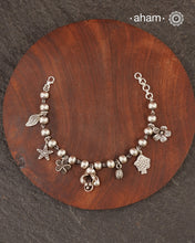 Up your wrist game with the A.M P.M Silver bracelet!
7 beautiful distinct charms all crafted in 92.5 silver come together to make this piece . Whether worn at day or night, this bracelet is Perfect for adding a playful touch to any outfit.

The price is for one piece only.