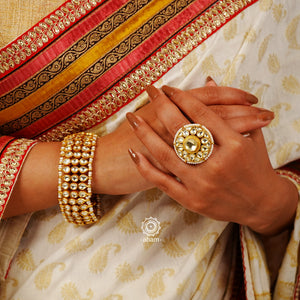 Handcrafted festive gold polish bracelet in 92.5 sterling silver with kundan work and embellished cultured pearls.