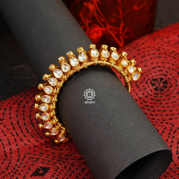 Handcrafted festive gold polish pauchi in 92.5 sterling silver with fine kundan work. 