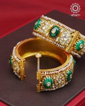 Elevate any outfit with our Kundan Gold Polish Silver Kada. Handcrafted with 92.5 sterling silver, this classic and versatile piece features green stone, mother of pearl, and pearl accents. Perfect for weddings and special occasions. Available in size 2.4 and openable design for easy wear.&nbsp;