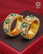 Elevate any outfit with our Kundan Gold Polish Silver Kada. Handcrafted with 92.5 sterling silver, this classic and versatile piece features green stone, mother of pearl, and pearl accents. Perfect for weddings and special occasions. Available in size 2.4 and openable design for easy wear.&nbsp;