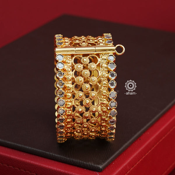 Looking for a gold toned accessory that works for both your Indian and western outfits? Then this is the perfect piece. Crafted in 92.5 silver with gold polish, this versatile kada is a must have addition to your wardrobe. 