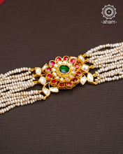 Expertly handcrafted with intricate Kundan work, this sterling silver Bracelet features a stunning gold polish and delicate pearl handwork. Perfect for any festive occasion, it adds a touch of elegance to any outfit. Elevate your style with this beautiful piece.