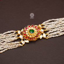 Expertly handcrafted with intricate Kundan work, this sterling silver Bracelet features a stunning gold polish and delicate pearl handwork. Perfect for any festive occasion, it adds a touch of elegance to any outfit. Elevate your style with this beautiful piece.