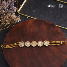 Embrace the allure of timeless elegance with Aham Jewellery’s latest Mother of Pearl collection, a radiant choice for festive celebrations and weddings.

The bracelet is crafted in 92.5 silver and adorned with a luxurious gold polish, capturing the iridescent beauty of mother of pearl.