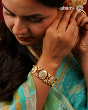 Embrace the allure of timeless elegance with Aham Jewellery’s latest Mother of Pearl collection, a radiant choice for festive celebrations and weddings.

The bracelet is crafted in 92.5 silver and adorned with a luxurious gold polish, capturing the iridescent beauty of mother of pearl.