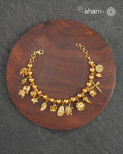 Up your wrist game with the A.M P.M Silver bracelet! 15 beautiful distinct charms all crafted in 92.5 silver with gold polish come together to make this piece.&nbsp;Whether worn at day or night, this bracelet is Perfect for adding a playful touch to any outfit.&nbsp;

The price is for one piece only.