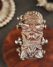 Our collection proudly showcases a rare and exquisite pair of vintage Todo or Kalla anklets, originating from the culturally rich region of Gujarat, India. These anklets transcend mere adornments; they are a testament to the artistry and craftsmanship of generations past. Handcrafted with meticulous precision using solid silver and employing remarkable repousse and chasing techniques, they exemplify the unparalleled skill of artisans who have honed their craft over centuries.
