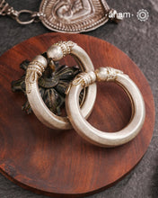 Vintage silver hollow kadas crafted in silver. They are small in size and fits upto bangle size 2.2. Twist and wear style. Comes with fine rava work.Beautiful piece from a bygone era, that bring back memories and stories of that time.