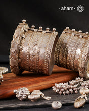 The Kambi Kadla.
Typically worn by Rabari and Mehr Women
Region: Gujarat

Vintage silver&nbsp;kada&nbsp;with intricate work, handcrafted&nbsp;by skilful artisans.&nbsp;Beautiful piece from a bygone era, that bring back memories and stories of that time.&nbsp;

Since this is a big size piece we recommend that you team it up with a smaller kada in the front. This one is a beautiful collectors piece and a rare find.&nbsp;

Price is for a pair. Incase you want to get a single piece please get in touch at 888444