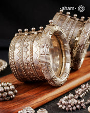 The Kambi Kadla.
Typically worn by Rabari and Mehr Women
Region: Gujarat

Vintage silver&nbsp;kada&nbsp;with intricate work, handcrafted&nbsp;by skilful artisans.&nbsp;Beautiful piece from a bygone era, that bring back memories and stories of that time.&nbsp;

Since this is a big size piece we recommend that you team it up with a smaller kada in the front. This one is a beautiful collectors piece and a rare find.&nbsp;

Price is for a pair. Incase you want to get a single piece please get in touch at 888444