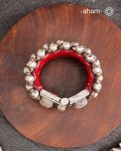 Tribal pauchi with silver bead work, handcrafted by skilful artisans. Beautiful handcuff from a bygone era, that bring back memories and stories of that time. Please note that we have not changed the original cotton threading that you see inside.