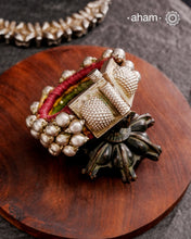 Tribal pauchi with silver bead work, handcrafted by skilful artisans. Beautiful handcuff from a bygone era, that bring back memories and stories of that time. Please note that we have not changed the original cotton threading that you see inside.