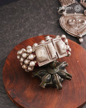 Tribal pauchi with silver bead work, handcrafted by skilful artisans. Beautiful handcuff from a bygone era, that bring back memories and stories of that time. Please note that we have not changed the original cotton threading that you see inside.