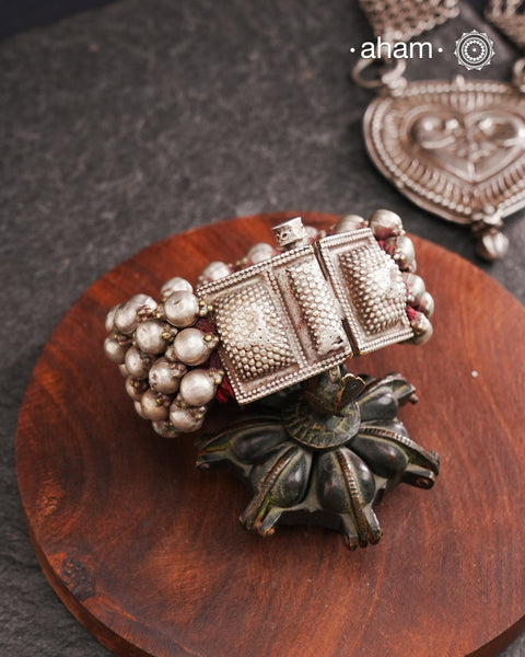 Tribal pauchi with silver bead work, handcrafted by skilful artisans. Beautiful handcuff from a bygone era, that bring back memories and stories of that time. Please note that we have not changed the original cotton threading that you see inside.