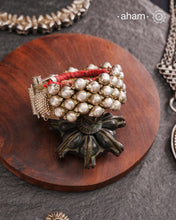Tribal pauchi with silver bead work, handcrafted by skilful artisans. Beautiful handcuff from a bygone era, that bring back memories and stories of that time. Please note that we have not changed the original cotton threading that you see inside.