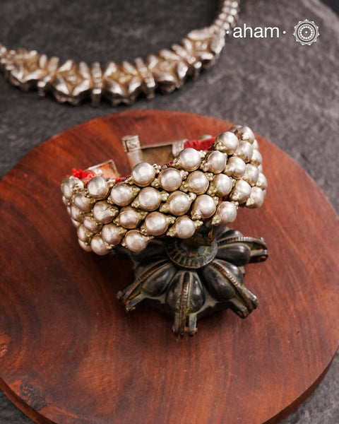 Tribal pauchi with silver bead work, handcrafted by skilful artisans. Beautiful handcuff from a bygone era, that bring back memories and stories of that time. Please note that we have not changed the original cotton threading that you see inside.