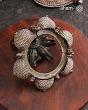 Vintage silver&nbsp;kada&nbsp;with intricate work, handcrafted&nbsp;by skilful artisans.&nbsp;Beautiful piece from a bygone era, that bring back memories and stories of that time. The Naugari Kada is a Two part bracelet with projected simulated gajre balls made from stamped silver sheet.