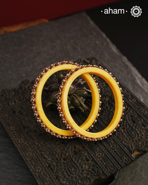 Beautiful tribal silver Bangles. Perfectly crafted silver flowers set on green plastic bangles. Comes as a set of 2 Bangles. AVAILABLE ON PREORDER BASIS