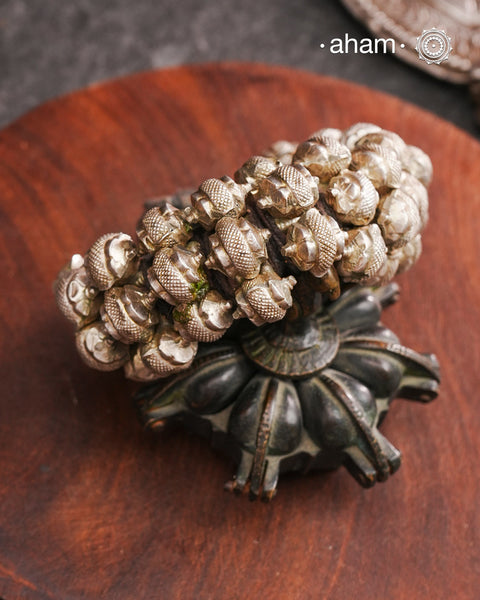 Tribal pauchi with silver bead work, handcrafted by skilful artisans. Beautiful handcuff from a bygone era, that bring back memories and stories of that time. Please note that we have not rethreaded it and kept the original threading of the pauchi.
