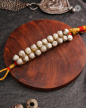 Tribal pauchi with silver bead work, handcrafted by skilful artisans.Beautiful handcuff from a bygone era, that bring back memories and stories of that time. 
