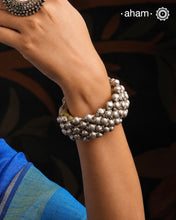 Tribal pauchi&nbsp;with&nbsp;silver bead work, handcrafted by skilful artisans. Beautiful handcuff from a bygone era, that bring back memories and stories of that time.
The price is for one piece only.