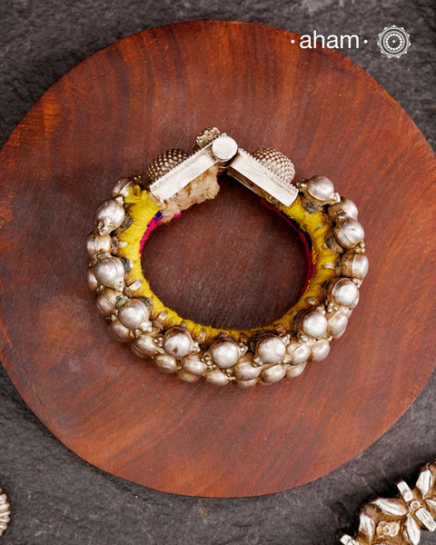 Tribal pauchi with silver bead work, handcrafted by skilful artisans. Beautiful handcuff from a bygone era, that bring back memories and stories of that time.