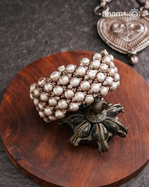 Tribal pauchi with silver bead work, handcrafted by skilful artisans. Beautiful handcuff from a bygone era, that bring back memories and stories of that time. Please note that we have not changed the original cotton threading that you see inside.