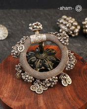 A statement vintage silver kada with knitted wire flexible tube silver and adorned with ghungroos. Intricate workmanship handcrafted by skilful artisans. Beautiful piece from a bygone era, that bring back memories and stories of that time.