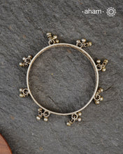 Tribal silver bangle in size 2.5 with little ghungroos. Comes as a single piece