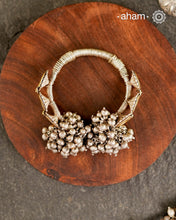 Two Vintage earrings have been wrapped with silver wire and converted in to a beautiful open cuff