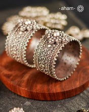 Vintage silver kada with rava and tar work handcrafted by skilful artisans. Beautiful piece from a bygone era, that bring back memories and stories of that time.
Price is for a pair. Incase you wish to buy a single piece please get in touch at 8884445300
