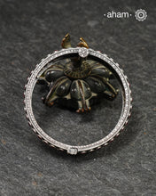 This handcrafted kada showcases the exceptional skill of Kolhapur's master karigars, created entirely from 92.5 sterling silver with striking kemp stone accents. The bangle demonstrates superior craftsmanship through its precise construction and refined finish. Kemp highlights add textural depth and visual interest to the classic kada silhouette. An investment piece that honours traditional jewellery-making heritage while offering versatile styling for both formal occasions and daily adornment.