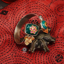 Noori Parrot hand cuff with a play of colours, textures, forms and workmanship. Crafted in 92.5 Sterling Silver with two tones that make them so versatile and unique. The price is for one piece kada only. 