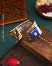 One of a kind statement wearable art pieces.Silver hand kada with a beautiful weave pattern, gold highlights and lapiz stone