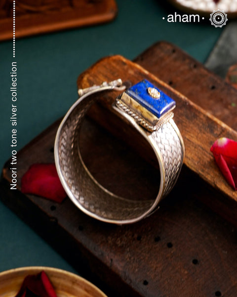 One of a kind statement wearable art pieces.Silver hand kada with a beautiful weave pattern, gold highlights and lapiz stone