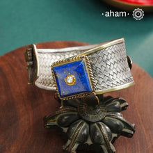 One of a kind statement wearable art pieces.Silver hand kada with a beautiful weave pattern, gold highlights and lapiz stone&nbsp;