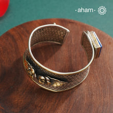 One of a kind statement wearable art pieces.Silver hand kada with a beautiful weave pattern, gold highlights and lapiz stone